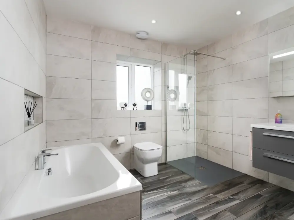 Bathroom installation in Cardiff with walk-in shower and wall-hung vanity